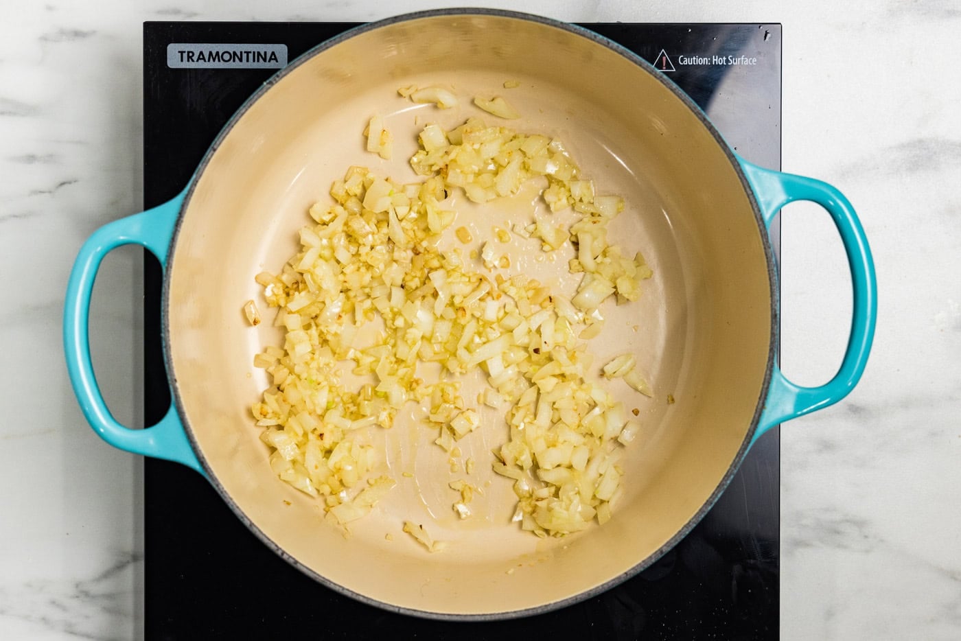 onions and garlic in duch oven pot