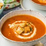 bowl of Homemade Tomato Soup with Fresh Tomatoes
