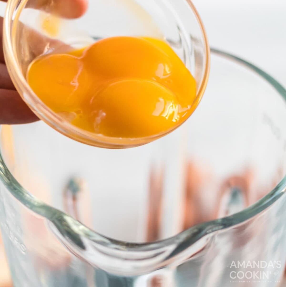 adding egg to blender