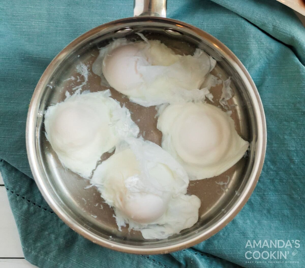 poached eggs in pan
