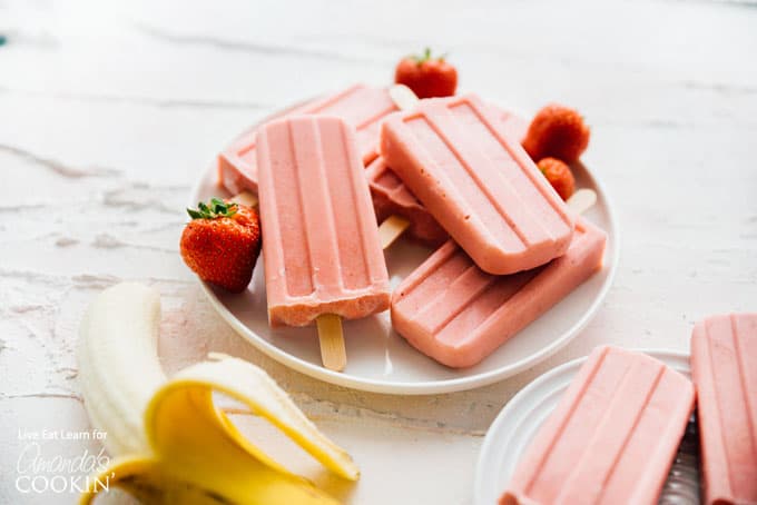 strawberry banana popsicles on plate