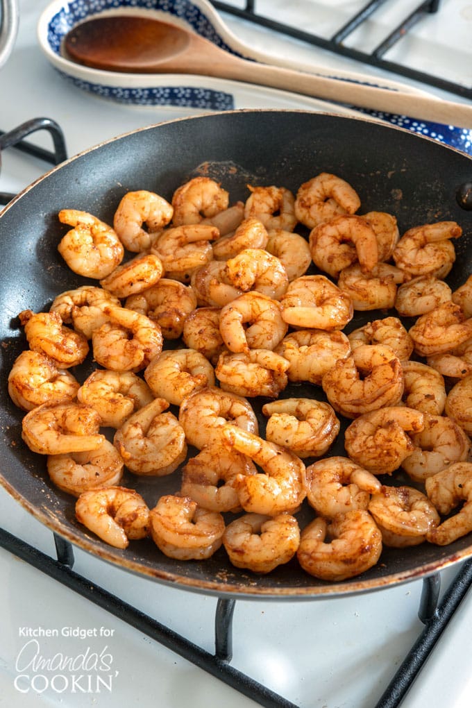 cooking seasoned shrimp in skillet