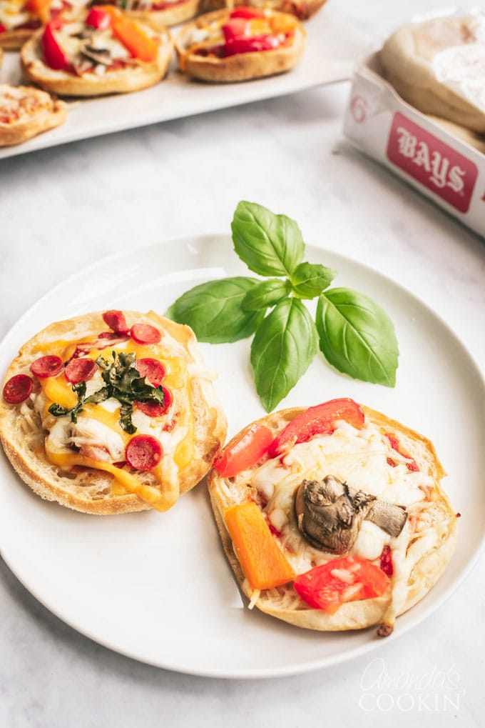 two english muffin pizzas on a plate