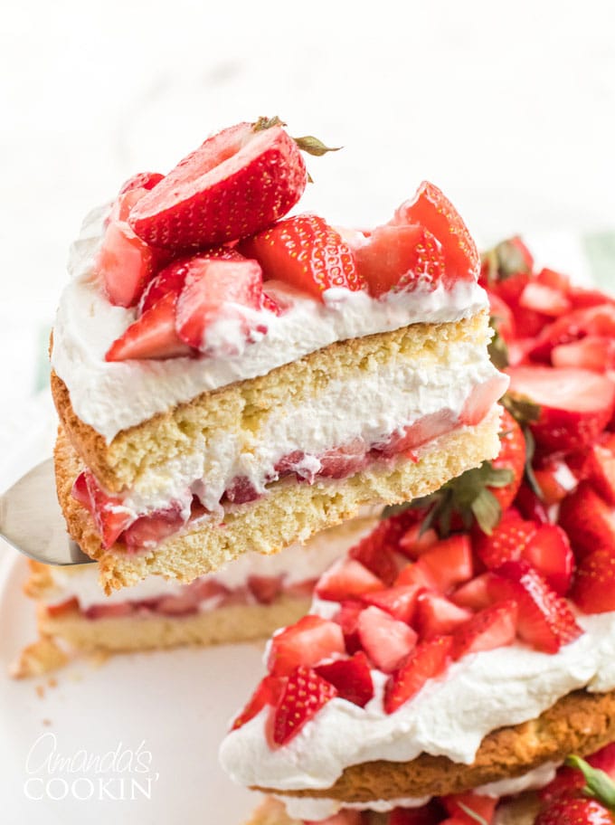 lifting a slice of strawberry shortcake with a pie server