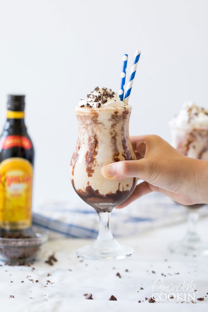 holding glass of frozen mudslide