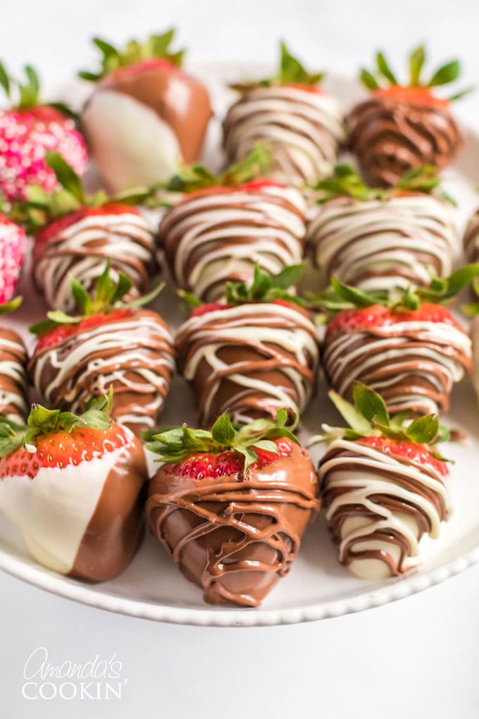 several drizzled chocolate covered strawberries