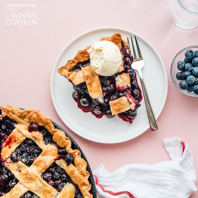 blueberry pie on plate with ice cream