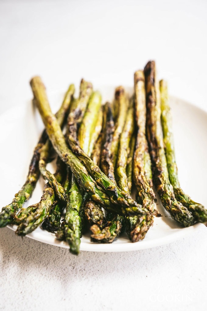 grilled asparagus on a white plate
