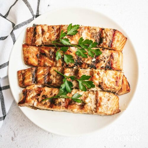 grill salmon garnished with parsley