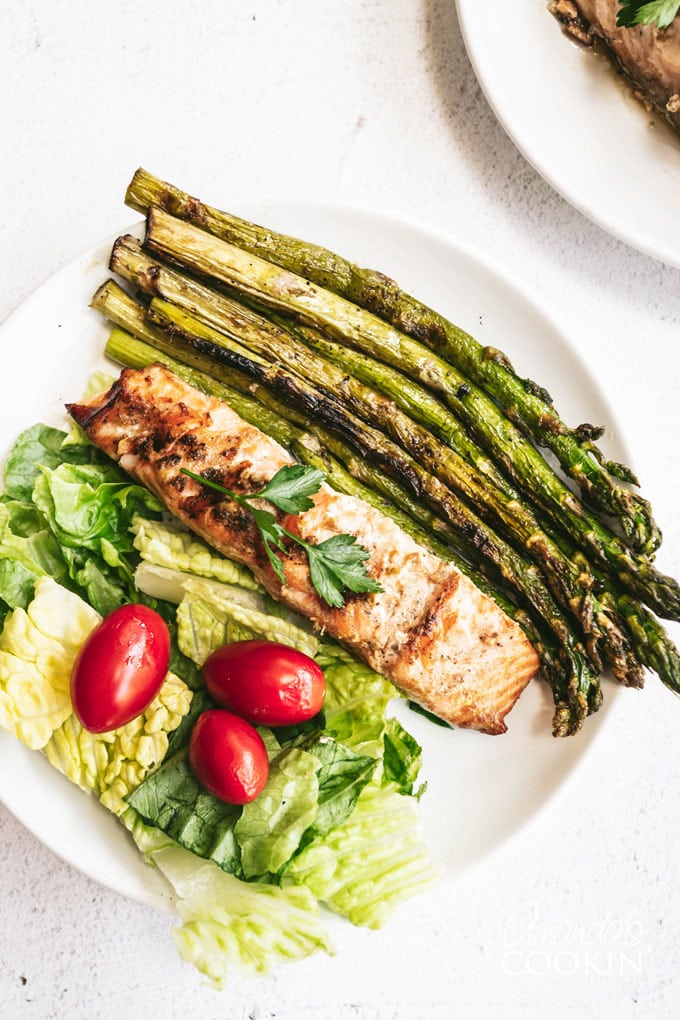 overhead view of grilled salmon and asparagus on plate