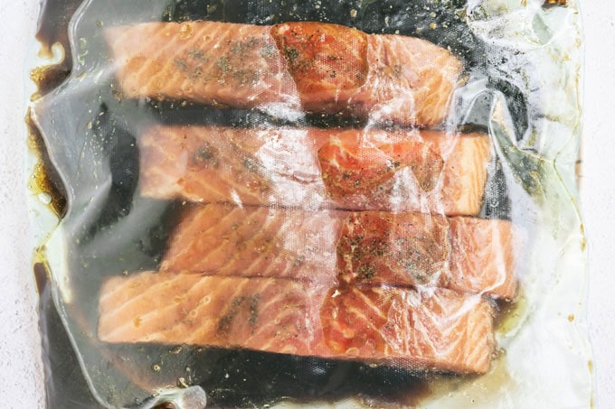 salmon filets in a bag with marinade