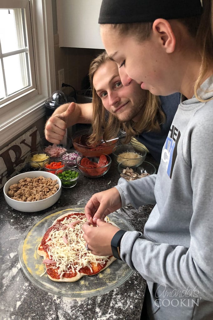 dominic and lindsay making their own personal pan pizzas