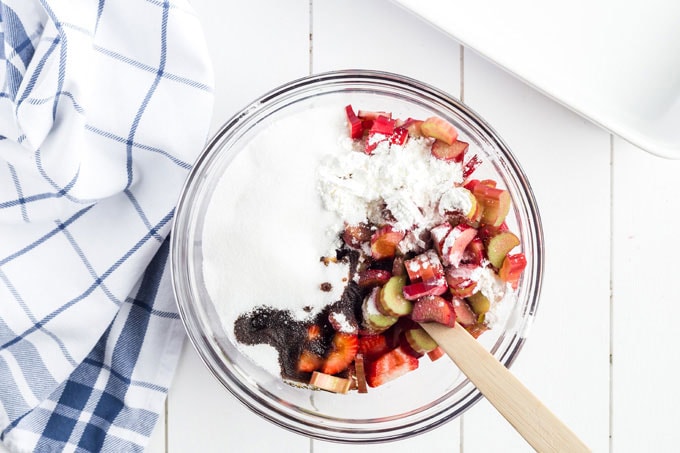 bowl of berries and rhubarb with sugar