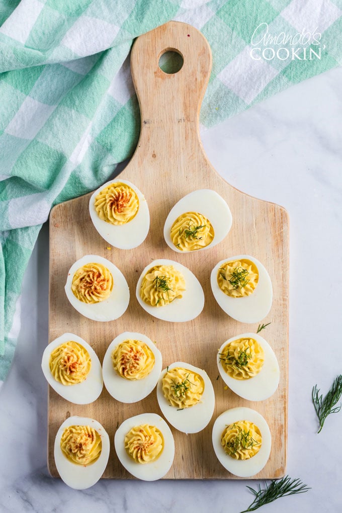OVERHEAD SHOT OF DEVILED EGGS ON A CUTTING BOARD