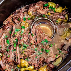 Mississippi Pot Roast in crockpot with ladle