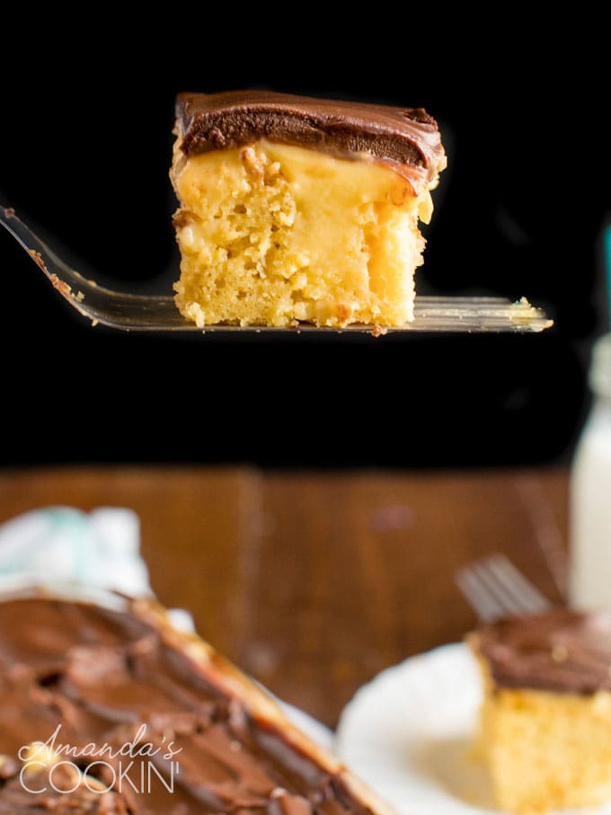 spatula holding a slice of poke cake