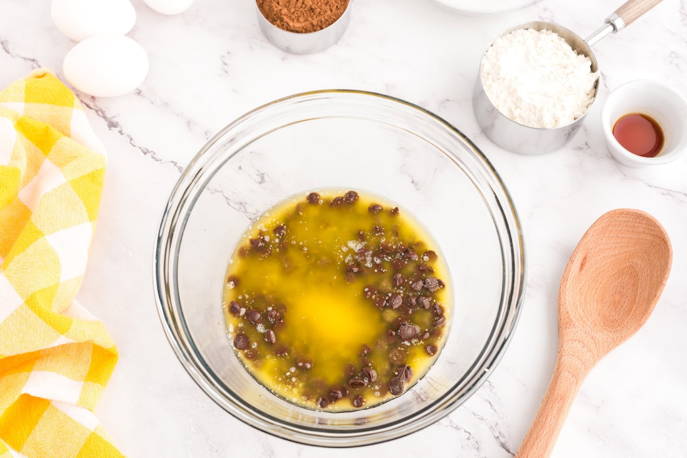 melted butter and chocolate chips in bowl