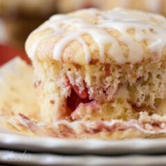 close up of strawberry muffin on a plate