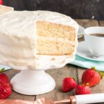 sliced white cake on a cake stand