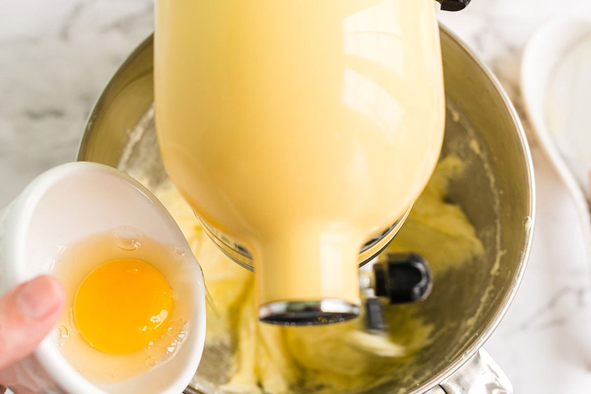 adding egg to mixer