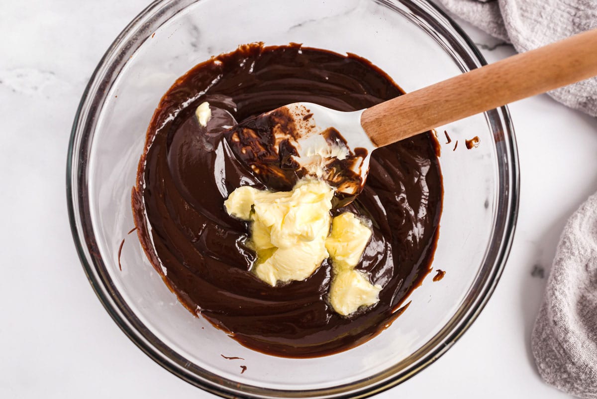 making chocolate ganache with hot cream, chocolate, and butter