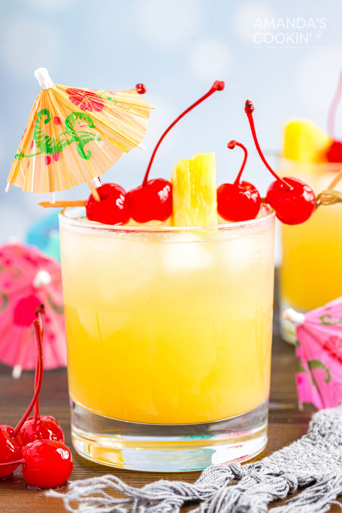 Mai Tai cocktail in a rock glass served with a cocktail umbrella