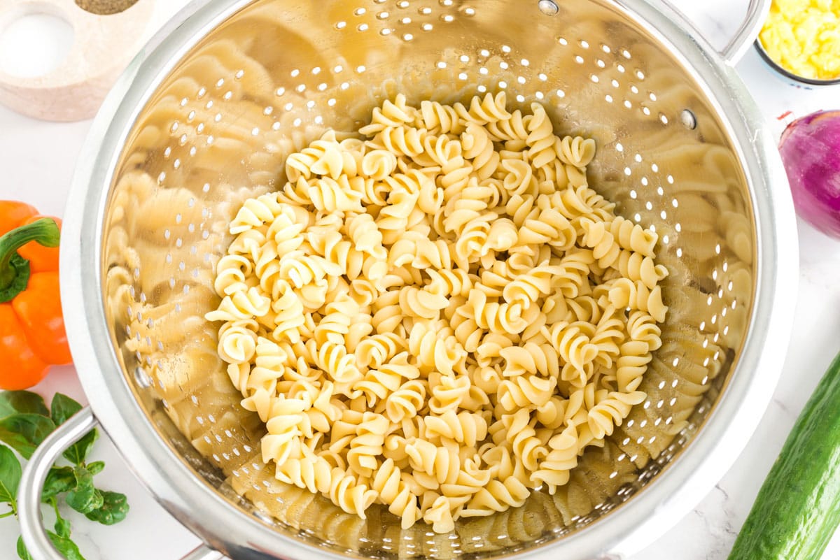 cooked pasta in a collander