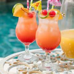 glasses of rum punch by pool