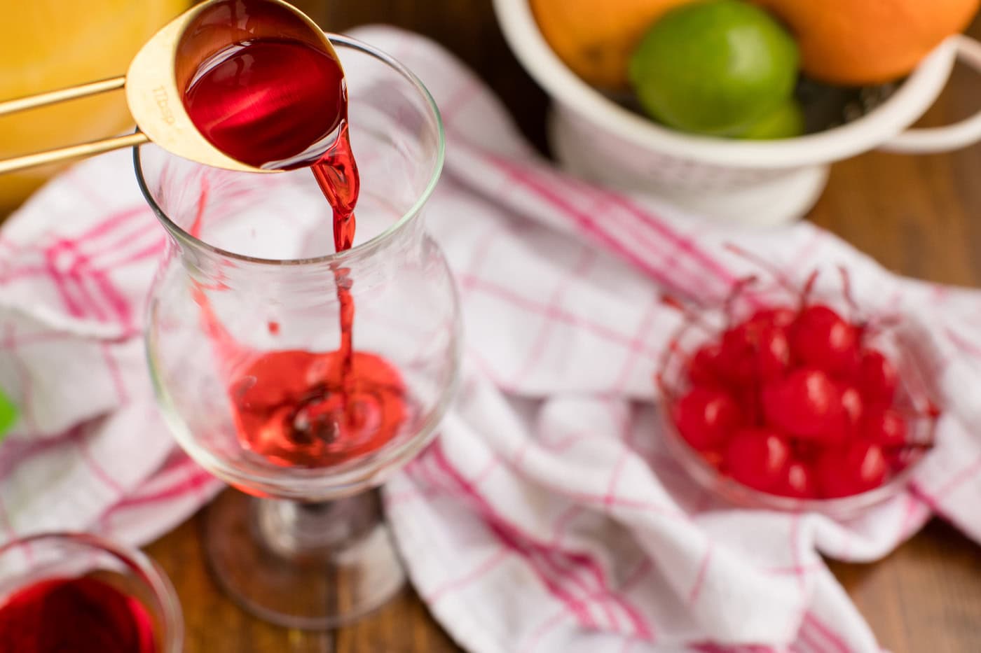 adding grenadine to a hurricane glass