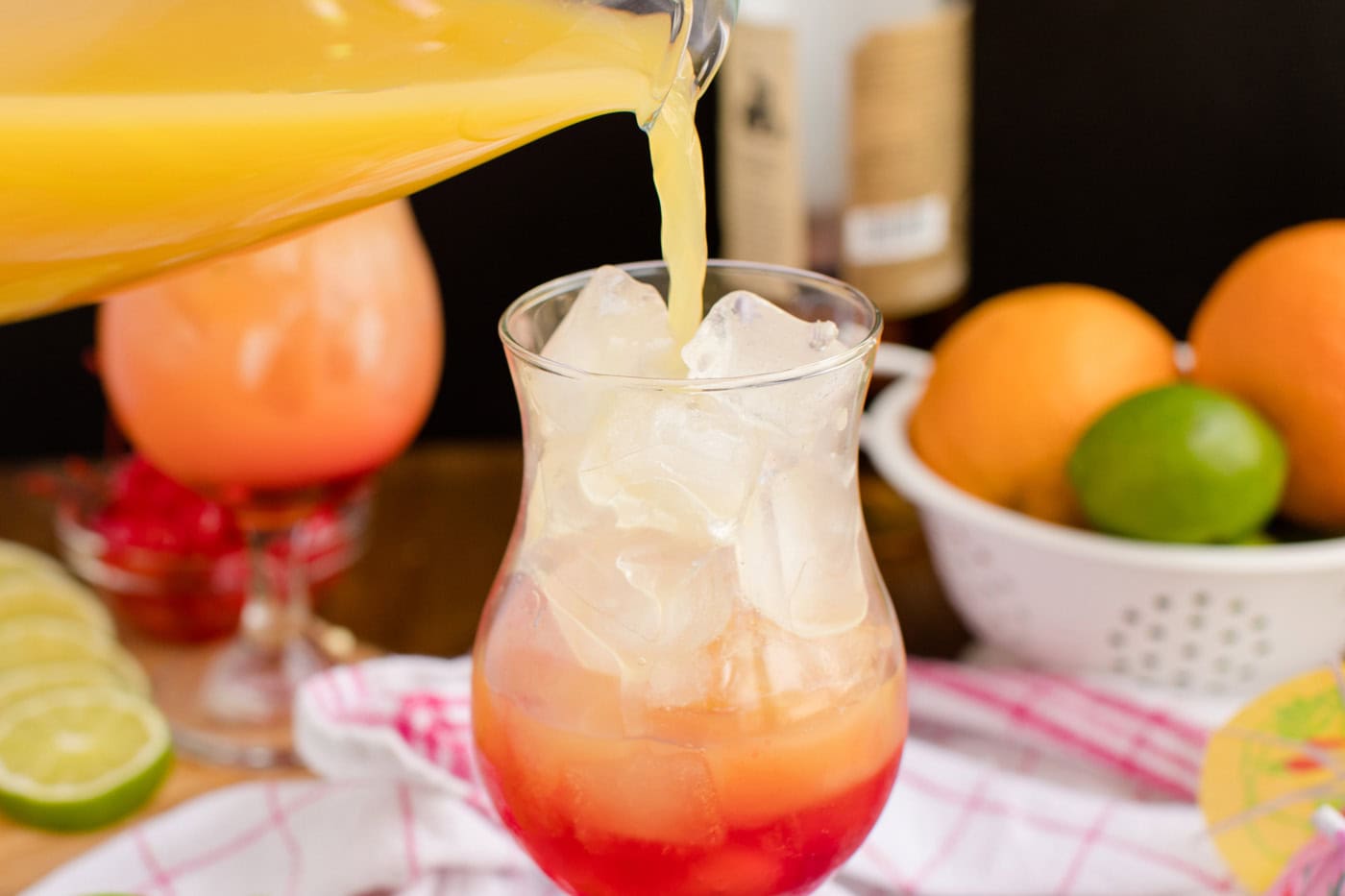poring rum punch into glass