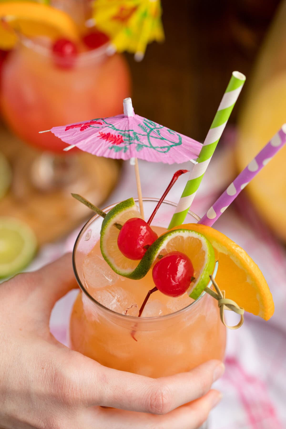 hand holding a glass of rum punch