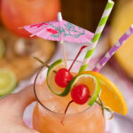 hand holding a glass of rum punch