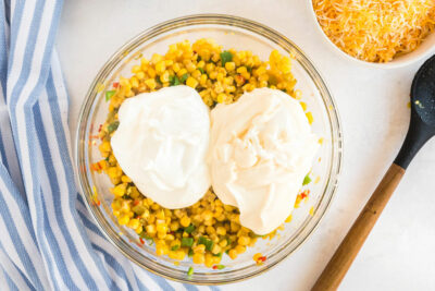 bowl of corn with mayo and sour cream added