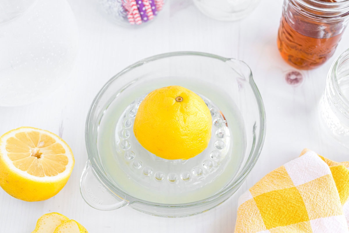 juicing a lemon on citrus juicer