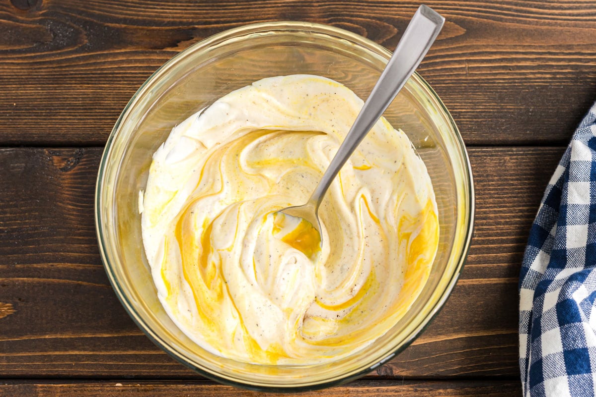 spoon in bowl of mayo and mustard