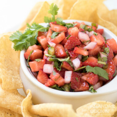 white bowl of strawberry salsa with chips