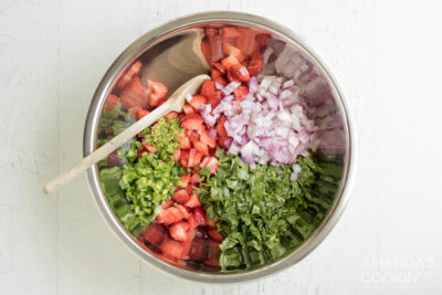 strawberry salsa ingredients in a silver bowl