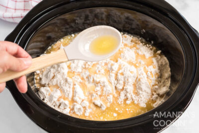 adding melted butter to crockpot