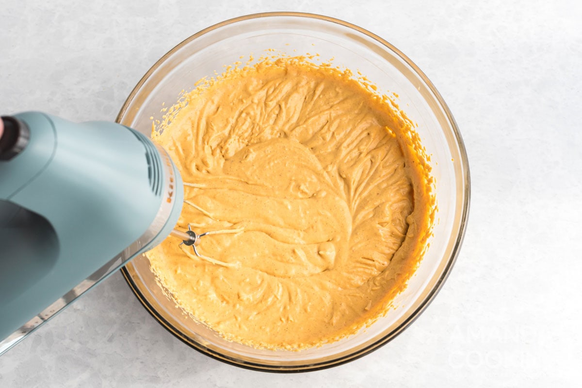 using a mixer to make cheesecake batter