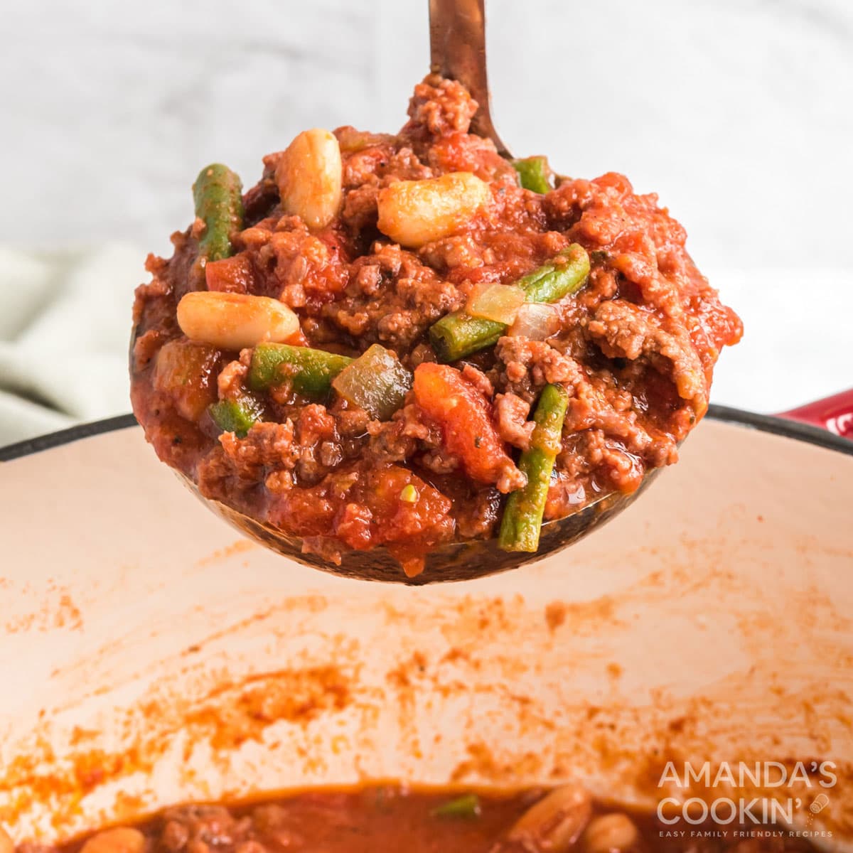 ladle full of hamburger stew
