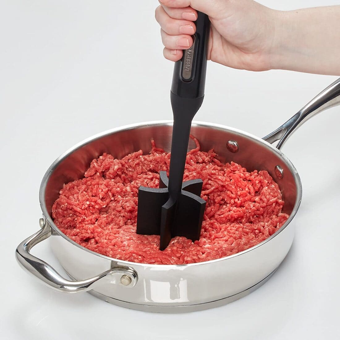 mashing ground beef