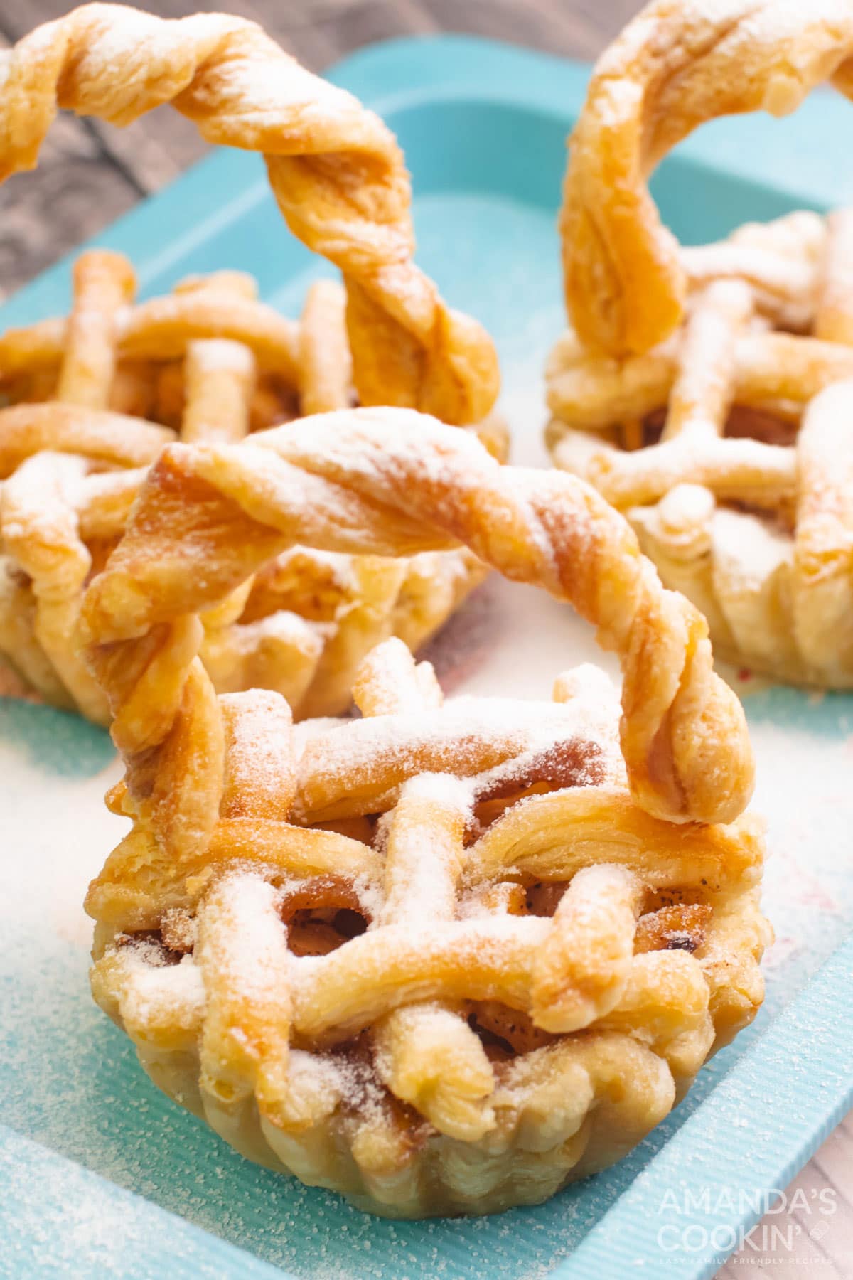 mini apple pies dusted with powdered sugar