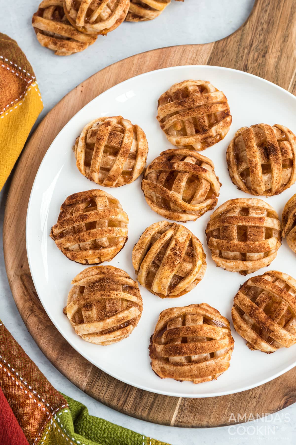 apple pie cookies on a round cutter board