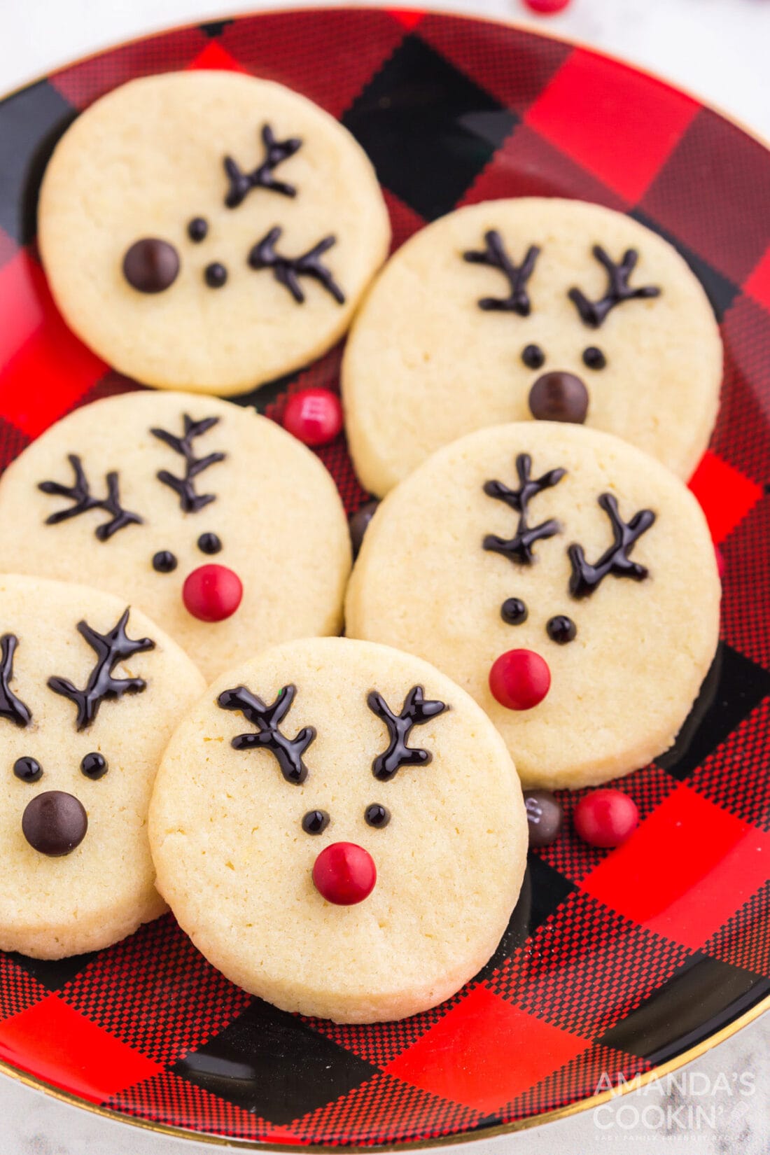 reindeer cookies on a red/black plate