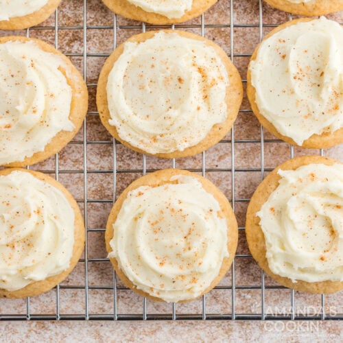 eggnog cookies with frosting on cooling rack