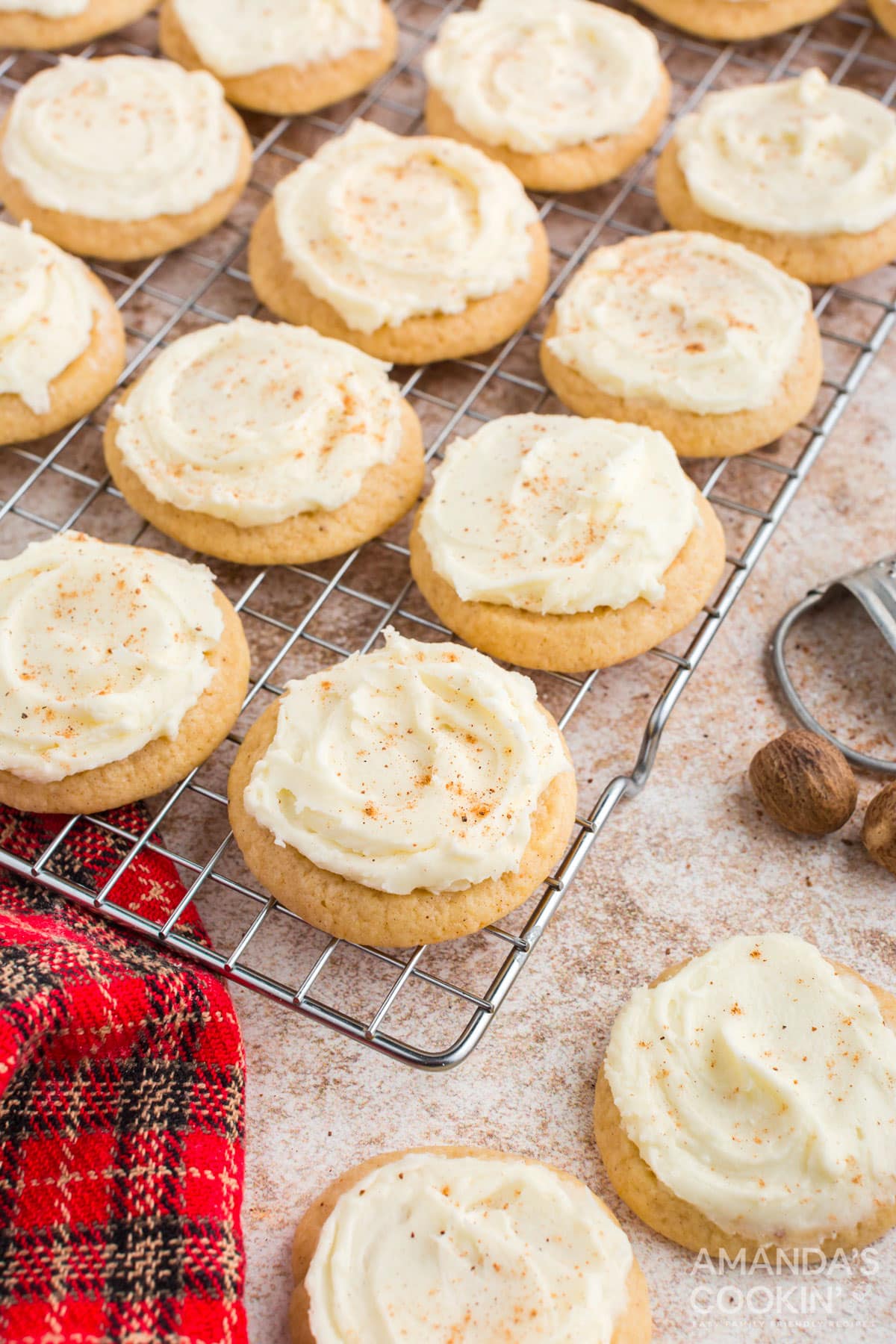 frosted eggnog cookies on a wire rack