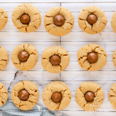 wire rack full of peanut butter blossom cookies
