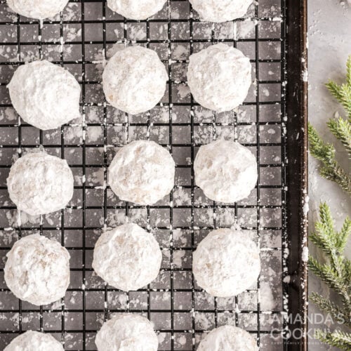 snowball cookies on a wire rack