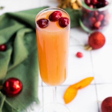 cranberry mimosa with cranberry garnish