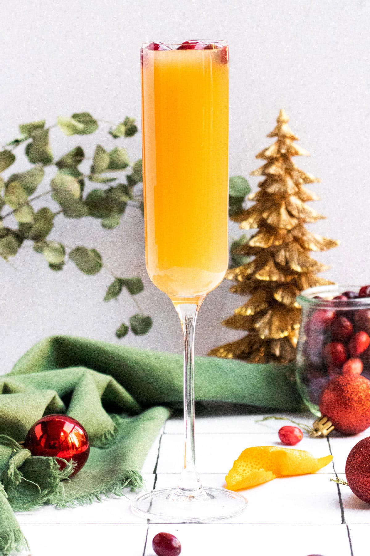 cranberry mimosa in a champagne flute